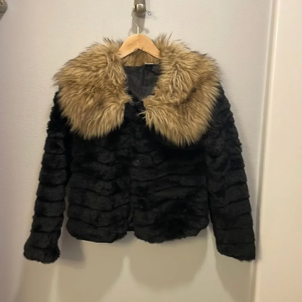 KAPOK Woman’s Black Faux Fur Coat With Faux Brown And Tan Trim Around The Neck